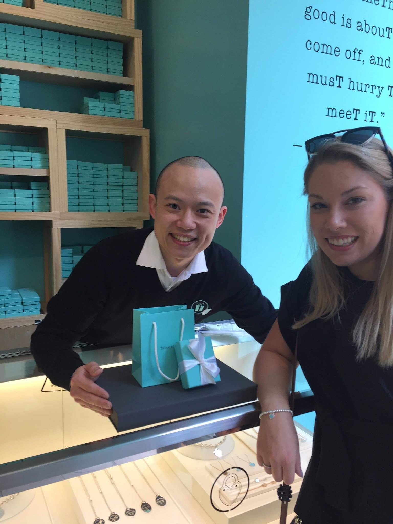 Raymond Yang assisting a client at Tiffany & Co.